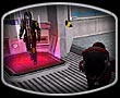 A Terran Republic Commander gets ready to ambush a New Conglomerate soldier while he heals himself at an advanced medical terminal.